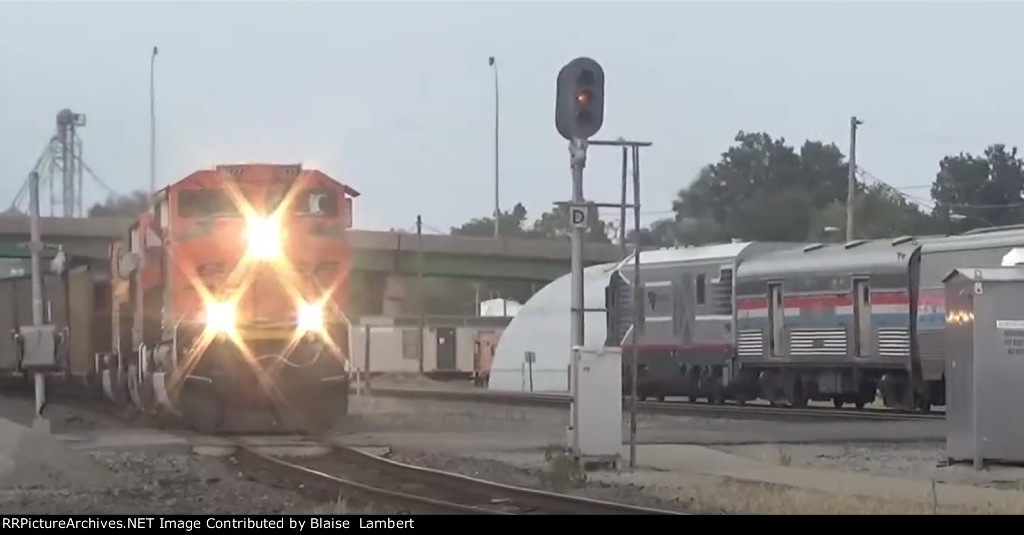 BNSF coal train passes Amtrak
